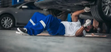 shutterstock_2392485449 Car service technicians inspect, analyze, diagnose suspension system issues in garage with precise tools. Detect, troubleshoot, repair problems. Ensuring optimal vehicle performance and safety